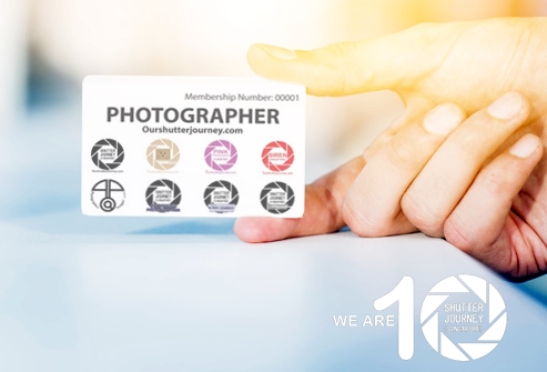 close-up-person-s-hand-holding-blank-white-card_23-2147899602